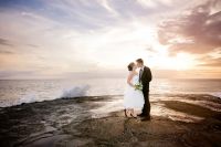Bride and groom on the beach in Maui
